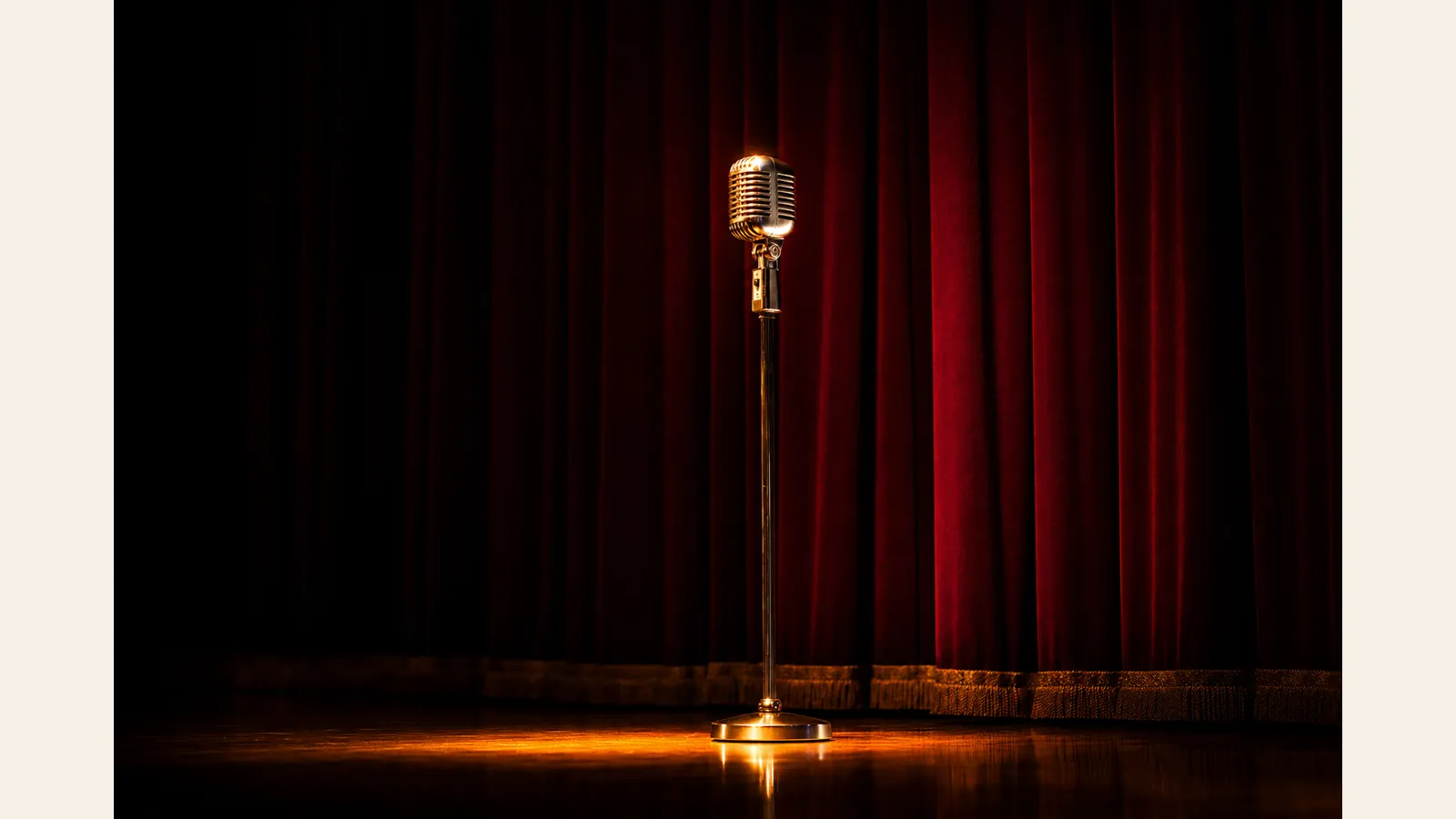 A vintage 1950s gold stage microphone on a stand under a single warm spotlight on a dark theater stage with a crimson velvet curtain — the moment that changed everything.